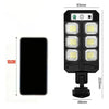 A black solar motion sensor LED outdoor wall light with multiple illuminated panels and mounting hardware.