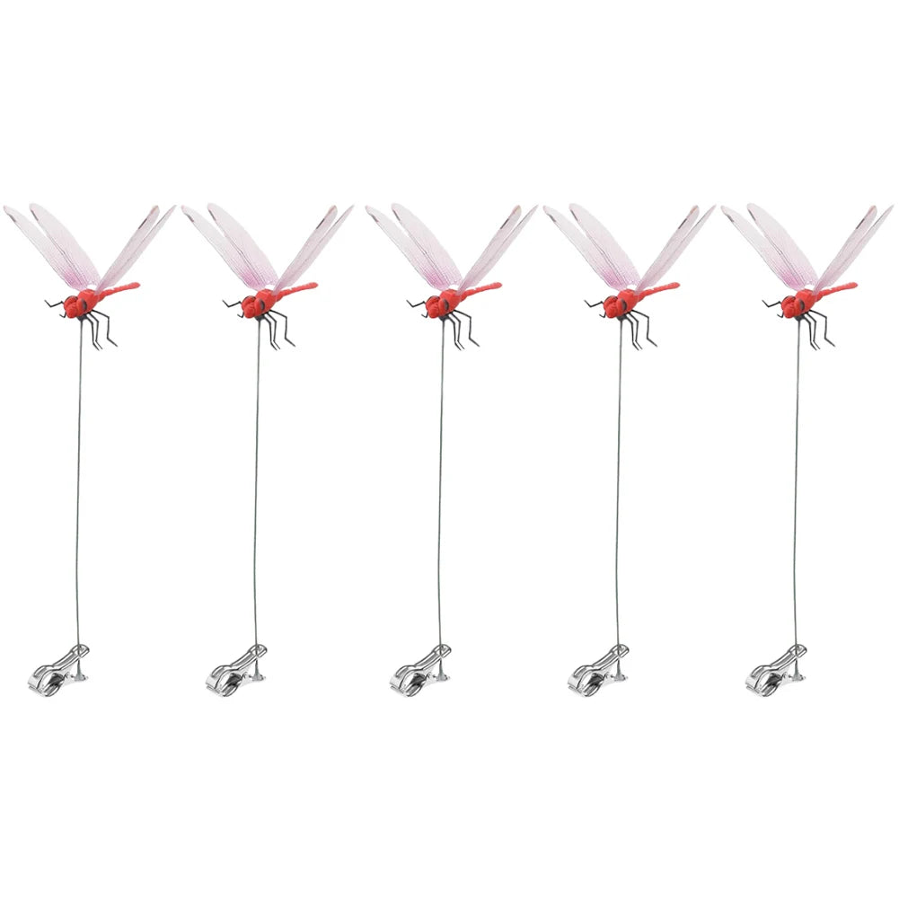 A set of realistic pink and red dragonfly clips for garden decor
