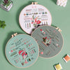 A collection of three embroidery hoops showing various stitches and designs for a beginner kit.