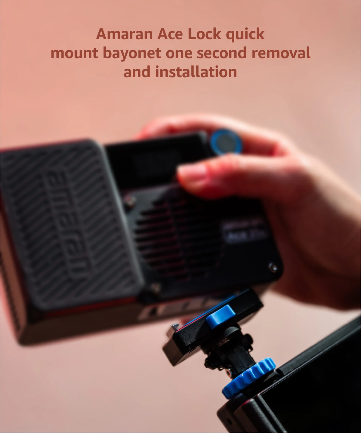 A hand is installing or removing a bayonet mount on an Amaran Ace Lock light kit.