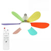 A white ceiling fan light with four colored blades and a remote control.
