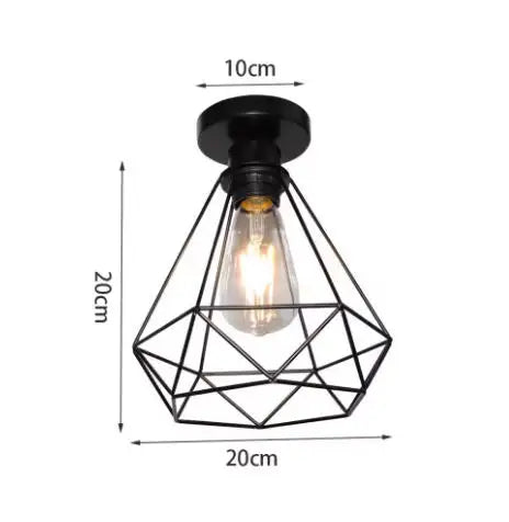 Black geometric wire frame chandelier lamp with an exposed filament light bulb