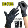 A hand wearing a black disposable nitrile glove is shown next to a package of 30 pairs of heavy duty gloves.