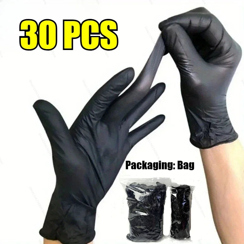 A hand wearing a black disposable nitrile glove is shown next to a package of 30 pairs of heavy duty gloves.