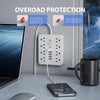 A white 8-outlet surge protection power strip with a red button and USB ports plugged into a wall outlet.