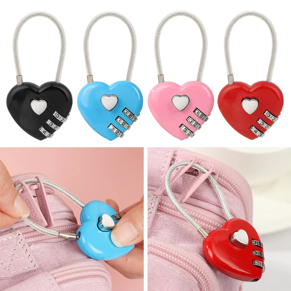 Red and pink heart-shaped combination locks with silver wire loops shown against a pink fabric background.