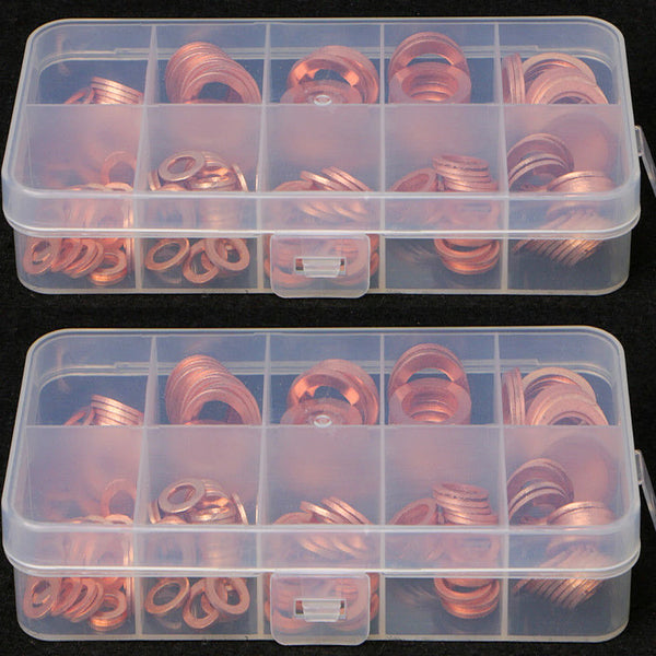 A clear plastic container holds a set of copper gaskets and washers.