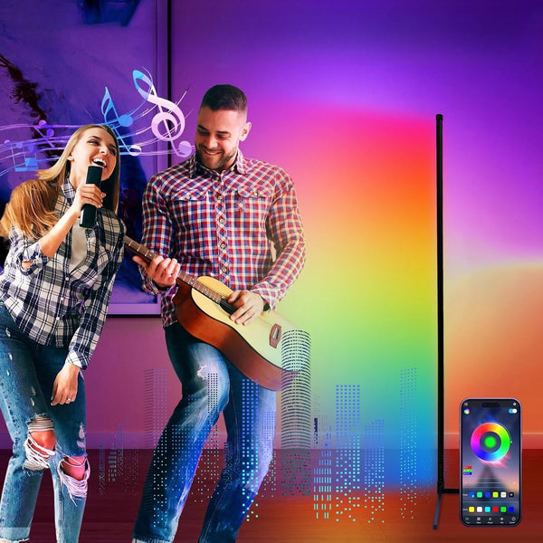 A male musician playing an acoustic guitar and a female singer performing on a stage with a dynamic RGB sync floor lamp in th