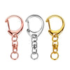 A set of three gold and rose gold lobster clasp key rings displayed against a white background.