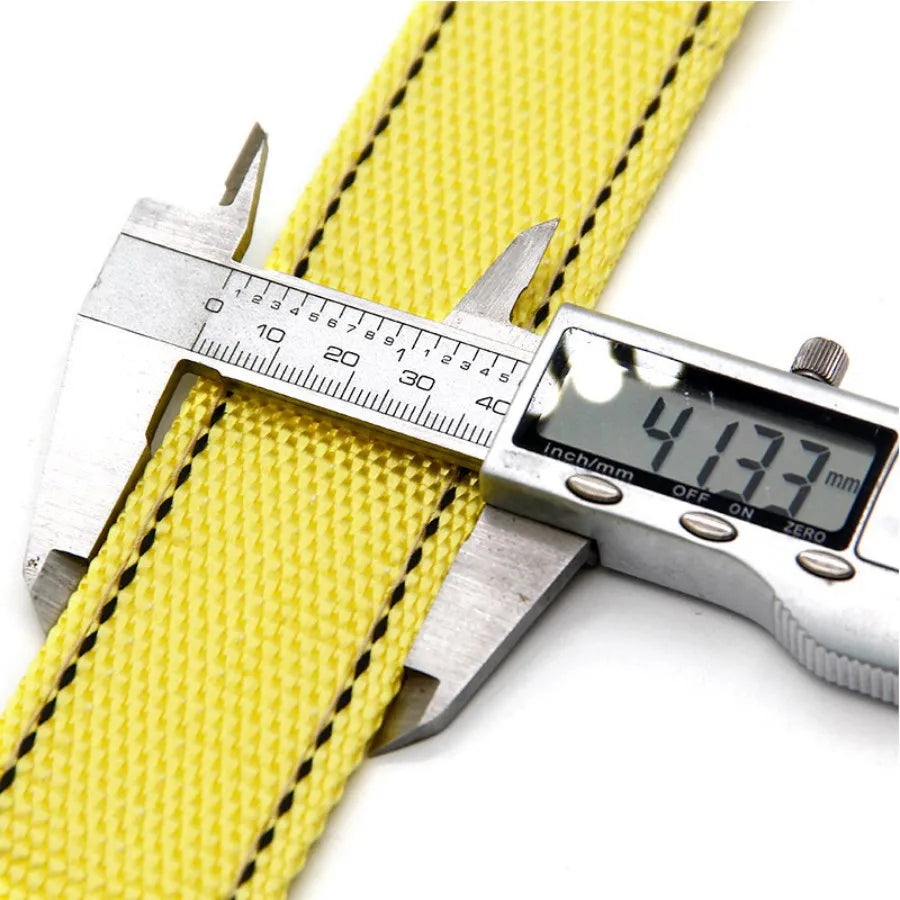 A yellow heavy duty towing rope is shown next to a digital caliper measuring its diameter.