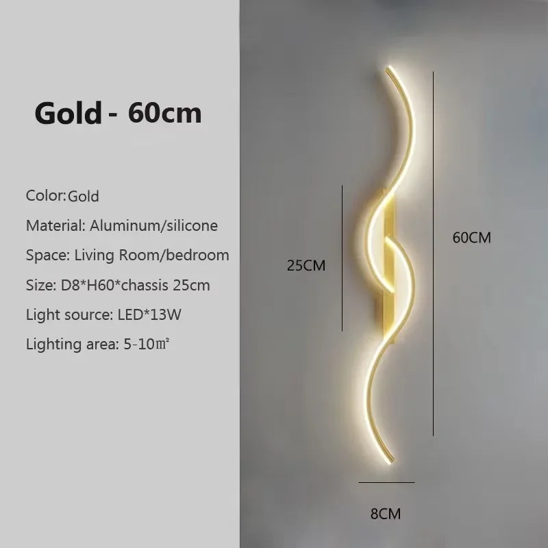 Gold 60cm modern LED wall sconce with a curved light design mounted on a wall.