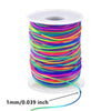 A spool of 1mm stretchy rainbow elastic cord for jewelry making, coiled on a white disk.