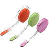 Three colored retractable dual scale measuring tapes showing different scales and lengths.