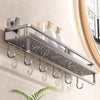 A silver metal rack organizer for holding soap and shampoo bottles mounted on a wall.