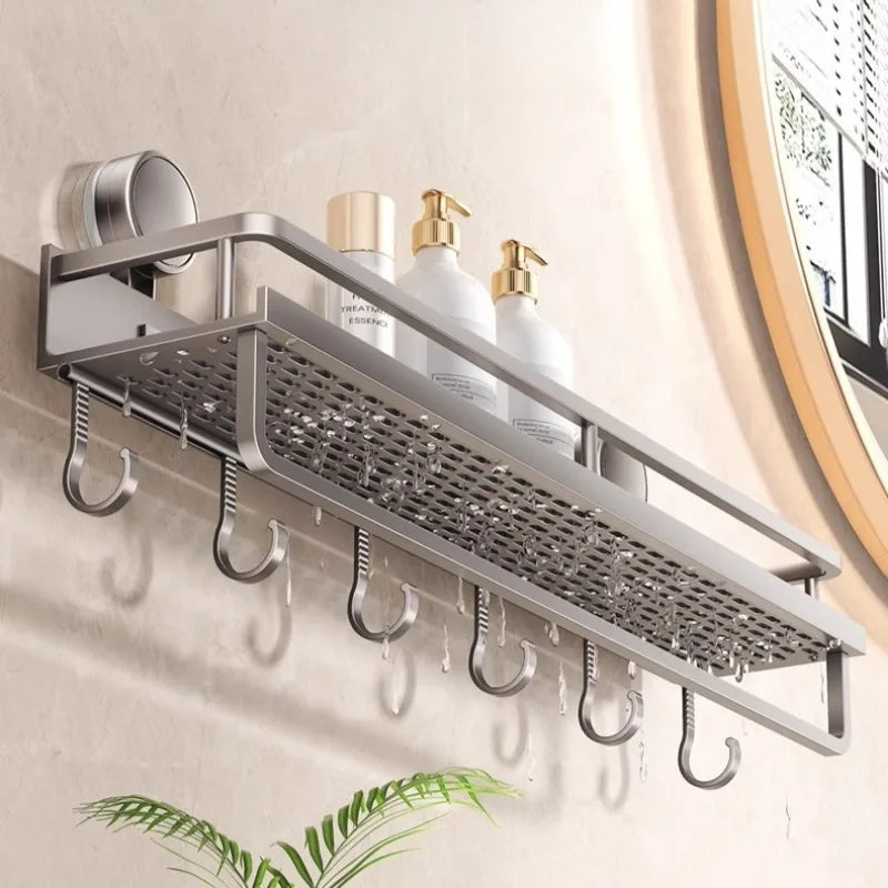 A silver metal rack organizer for holding soap and shampoo bottles mounted on a wall.