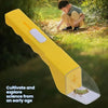 A yellow handheld pest catcher with a clear collection area is shown outdoors near a child.