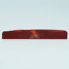A wooden guitar bridge saddle with the name Guyker and model number ATR-7431 engraved on it.