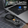 A digital handheld microscope with an LED light is placed on a laptop keyboard.