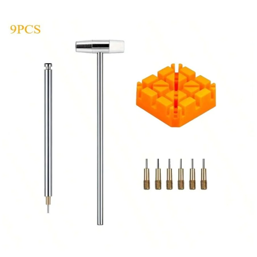 A set of nine metal watch link removal and repair tools, including a long pin and multiple small tools, displayed next to an 