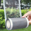 Roll of gray heavy duty screen repair tape being applied to a window screen.