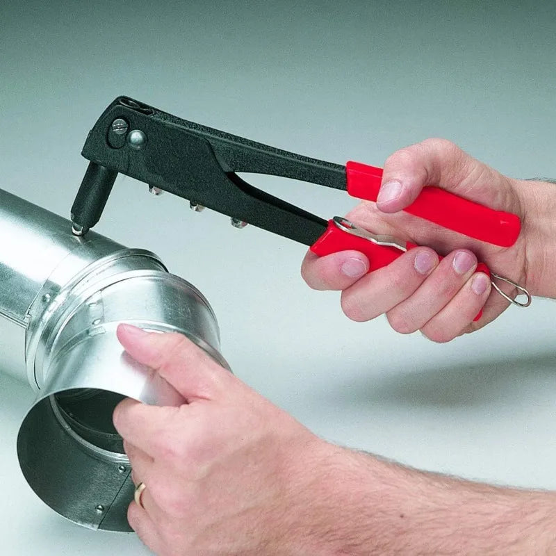 A hand is using a heavy duty hand rivet gun kit to install a metal component.