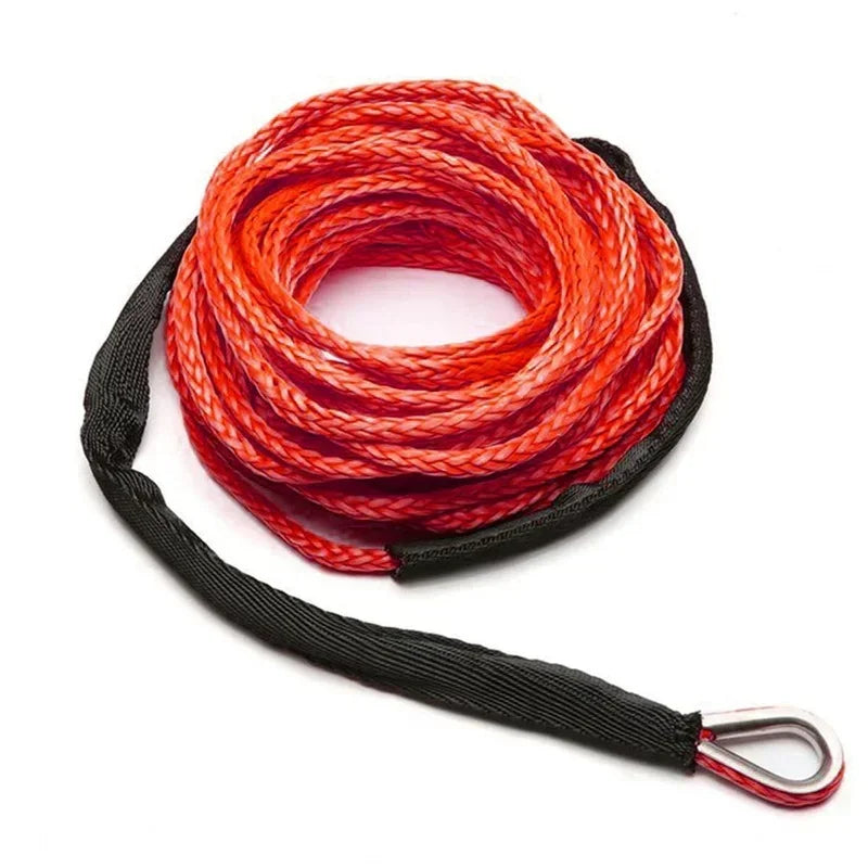 A coil of bright red heavy-duty synthetic tow strap with a black handle.
