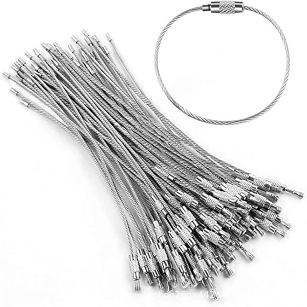 A set of stainless steel wire keychain tags with a circular loop and multiple straight wires.
