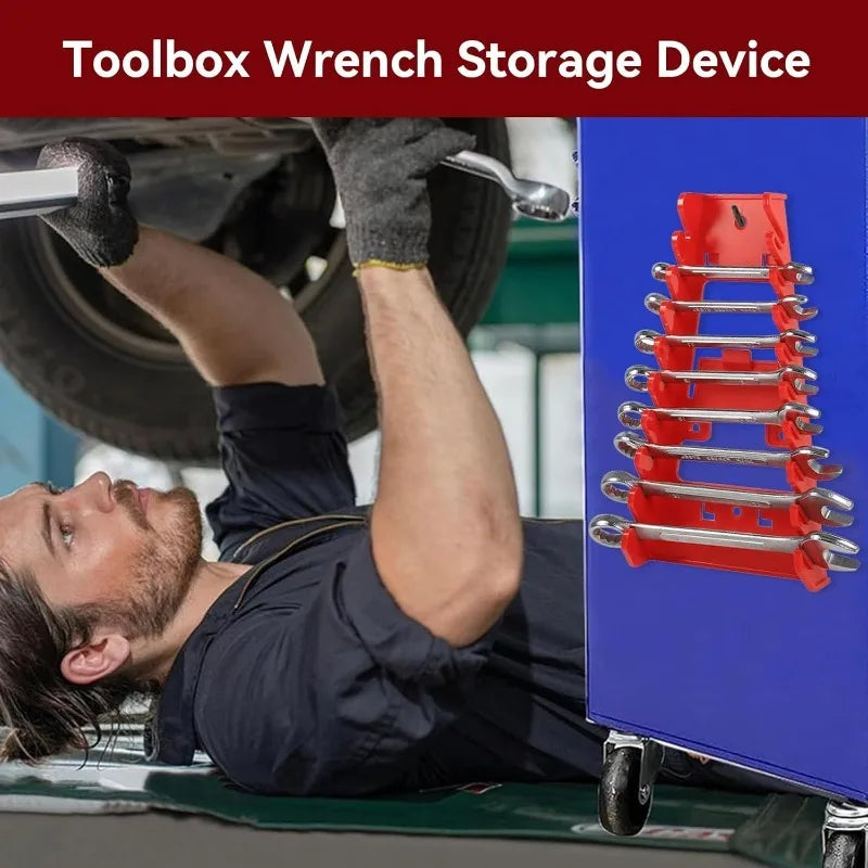 A close-up of a red plastic wrench organizer rack mounted on a blue storage device.