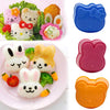 Set rosa, orange und blau Silikonformen und ein Reisball-Schüttler zum Formen niedlicher Tierfiguren.