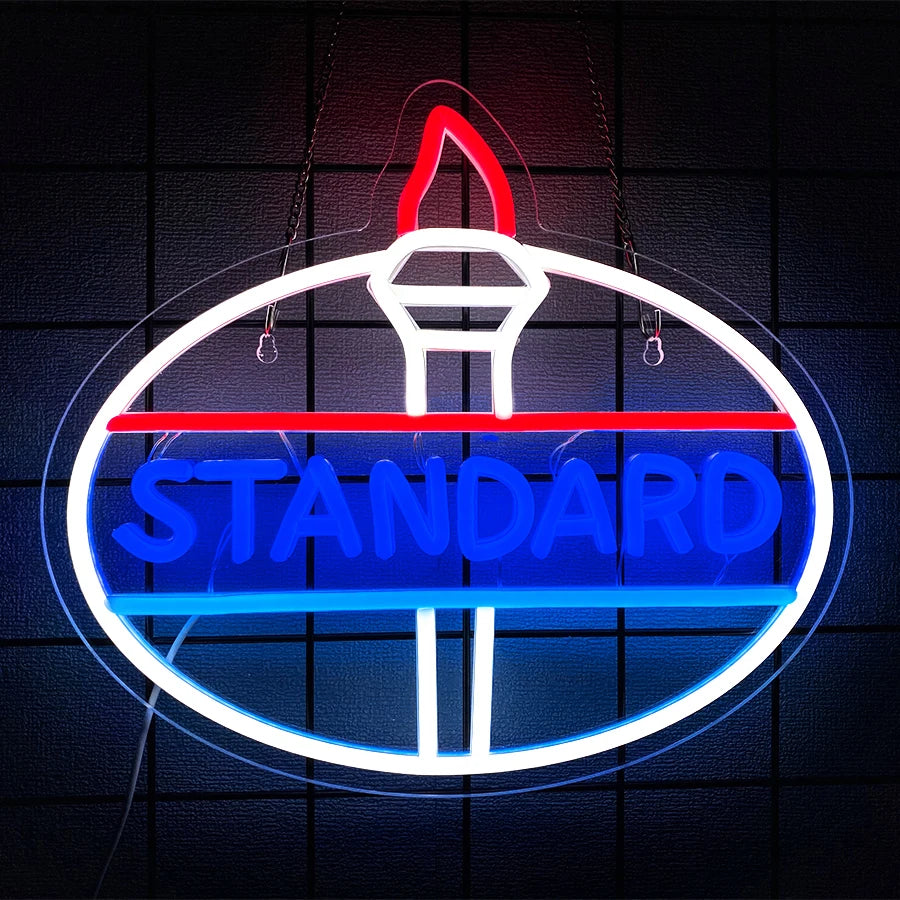 A circular neon sign featuring the word STANDARD in blue and red text on a dark background.