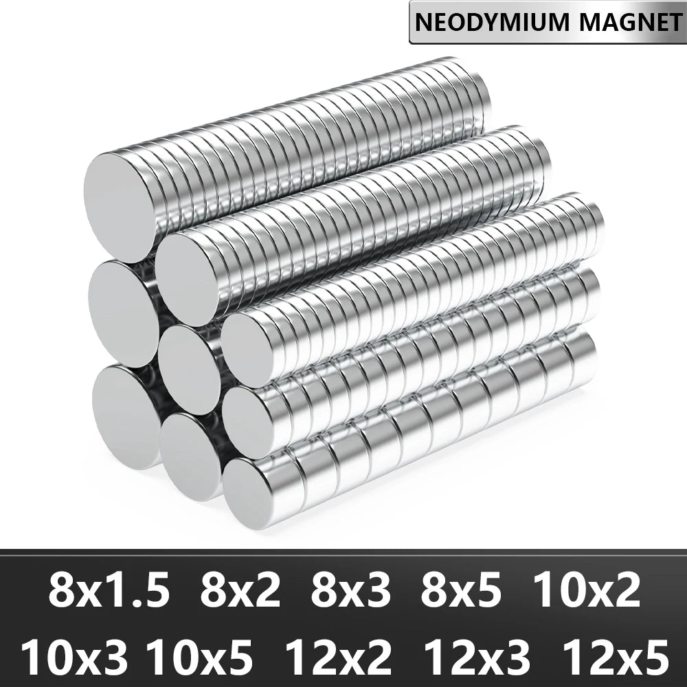 A collection of silver neodymium magnets in various sizes and thicknesses arranged in rows.
