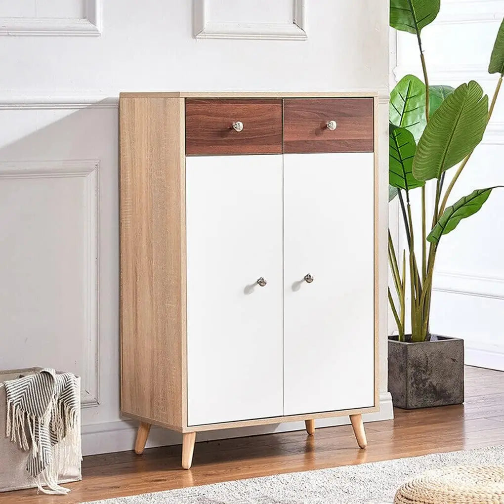 A light wood cabinet with white doors and a dark wood accent, featuring modern design.