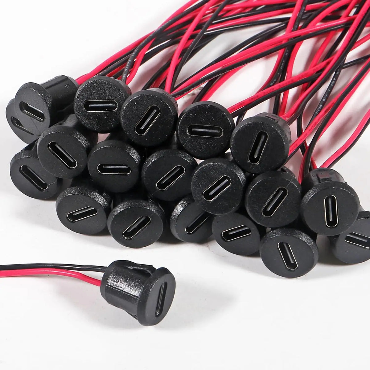 A bundle of black and red wires with female USB-C charging ports.