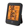 A black portable digital thermometer and hygrometer displaying temperature and humidity readings.