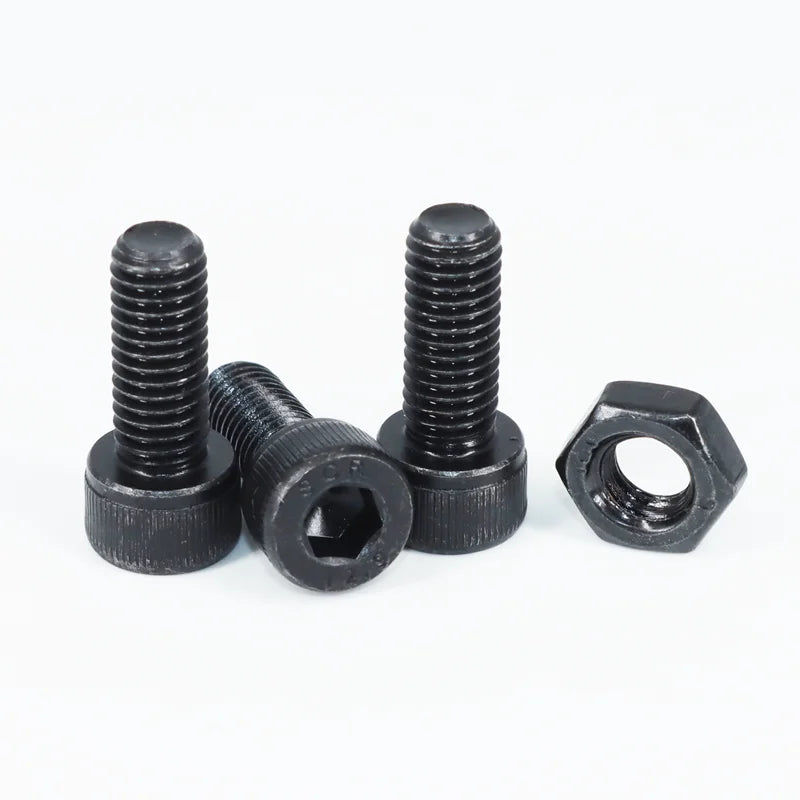 Assortment of black precision hex socket head cap screws and nuts.
