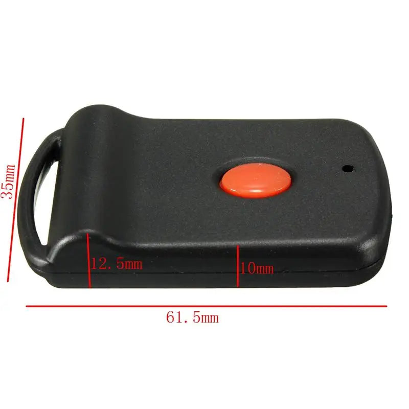 Black garage door remote transmitter with an orange button and a loop for hanging.