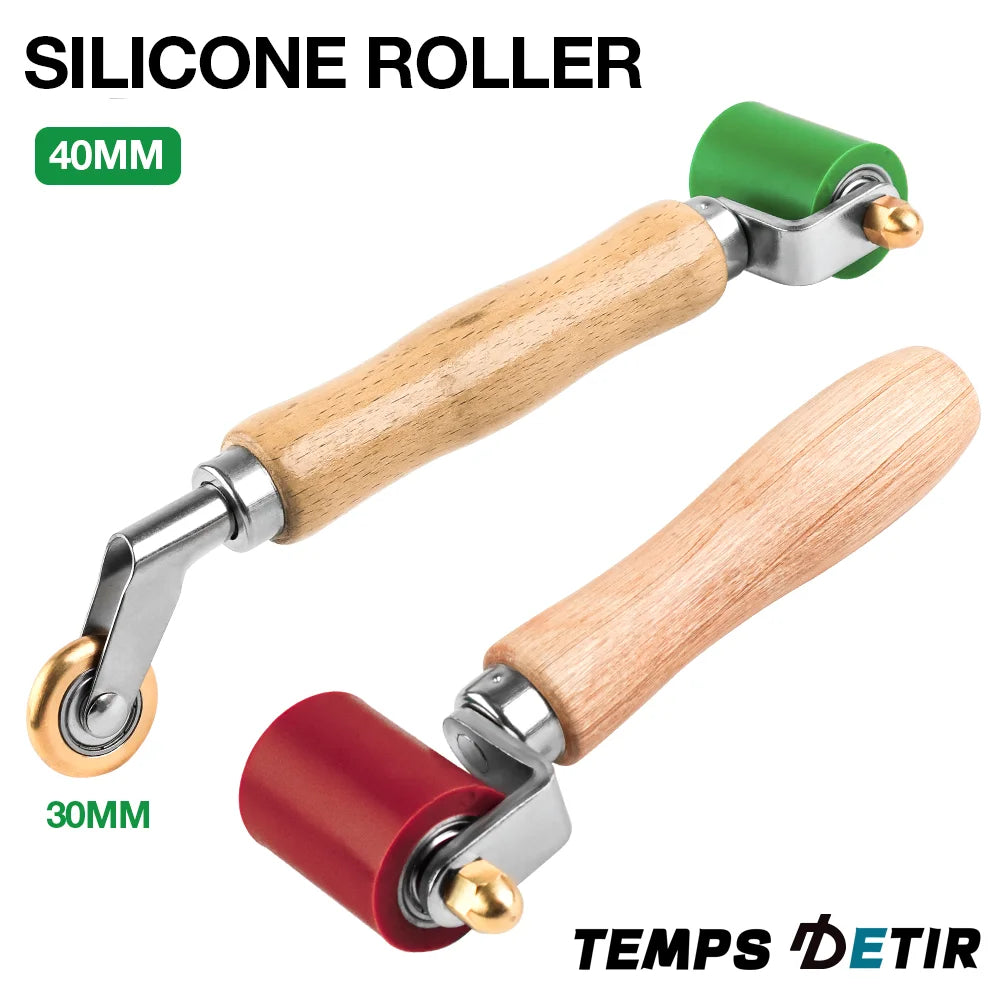A wooden handle silicone roller tool with a 40mm green roller and a 30mm red roller.