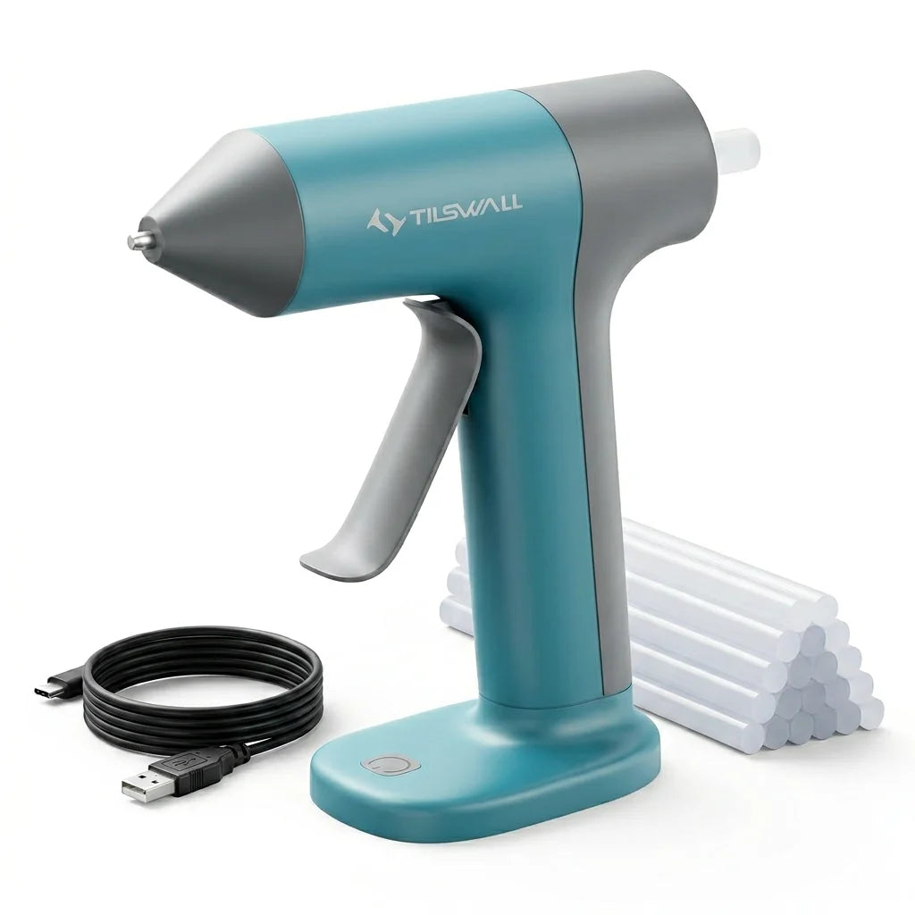 A teal and gray cordless hot glue gun with an attached power cord and a stack of glue sticks.