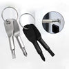 A pair of black and silver mini screwdrivers with metal keychains shown next to a close-up of a screwdriver head.