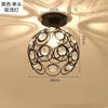 Black single bulb chandelier lamp with crystal accents and a modern design.