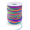 A spool of 1mm stretchy rainbow elastic cord for jewelry making, coiled on a white plastic base.