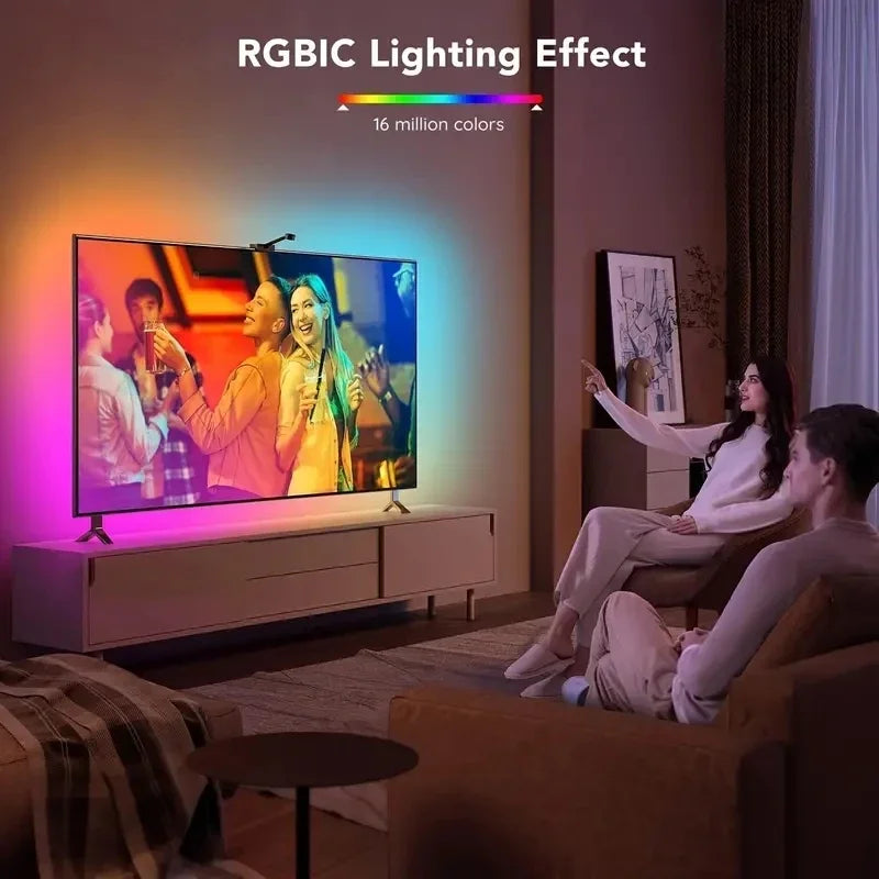 A television displaying a colorful image, illuminated by an RGBIC lighting effect.