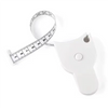 Mètre ruban télescopique blanc automatique à côté de son emballage.