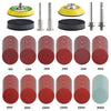 A collection of multi-grit alumina sanding discs in various sizes and shades of red and green.