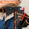 Black nylon axe blade cover attached to a belt, shown against a plaid shirt and denim background.