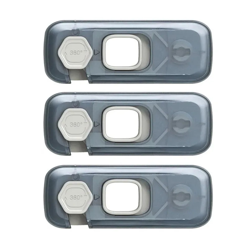 Three pieces of a toddler cabinet safety lock set, featuring a clear plastic lock with a 360 degree opening.