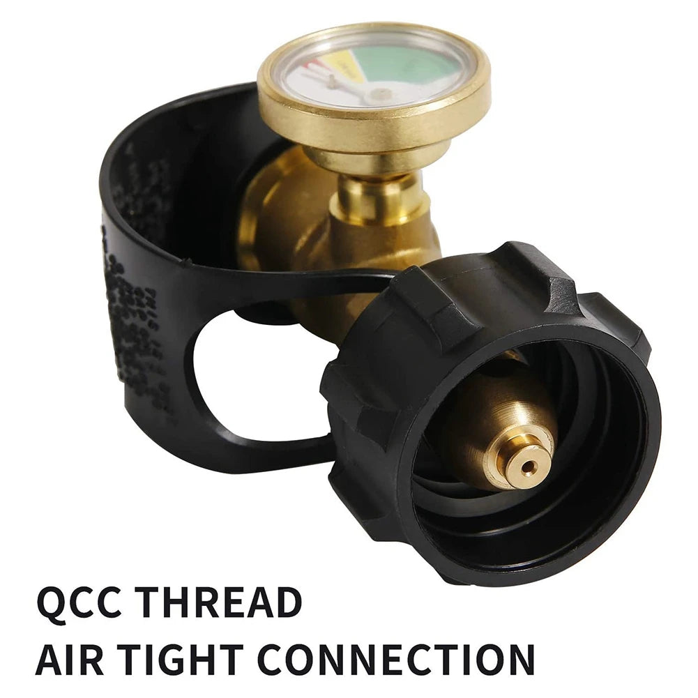 A black threaded connection fitting with a gauge for measuring pressure and an air tight connection.