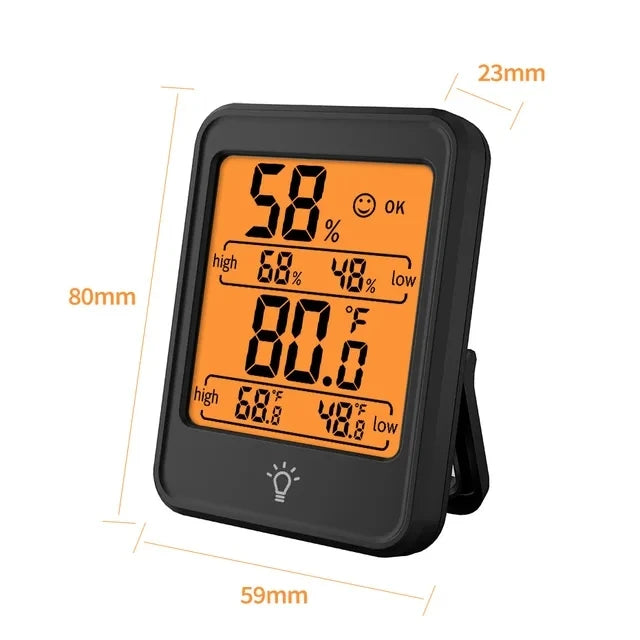 A black portable digital thermometer and hygrometer displaying a temperature of 58 degrees and humidity readings.