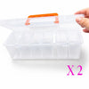 A hand holds a clear, multi-compartment plastic storage box with an orange lid and multiple transparent compartments inside.