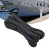 A thick black heavy duty double braid docking rope coiled and laid out for use.
